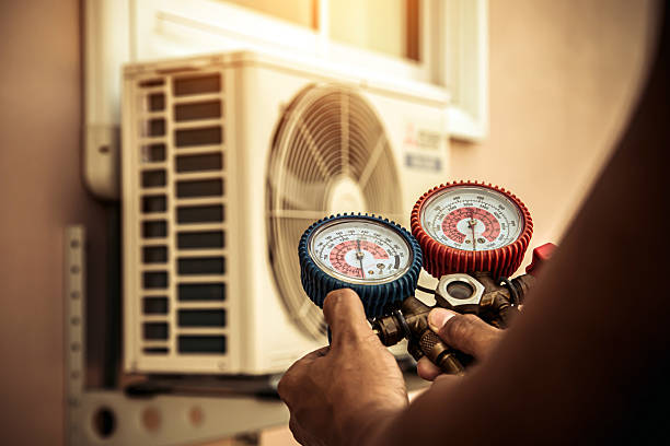 Professional Heat Pump Repair technician working in West Hyannisport, MA